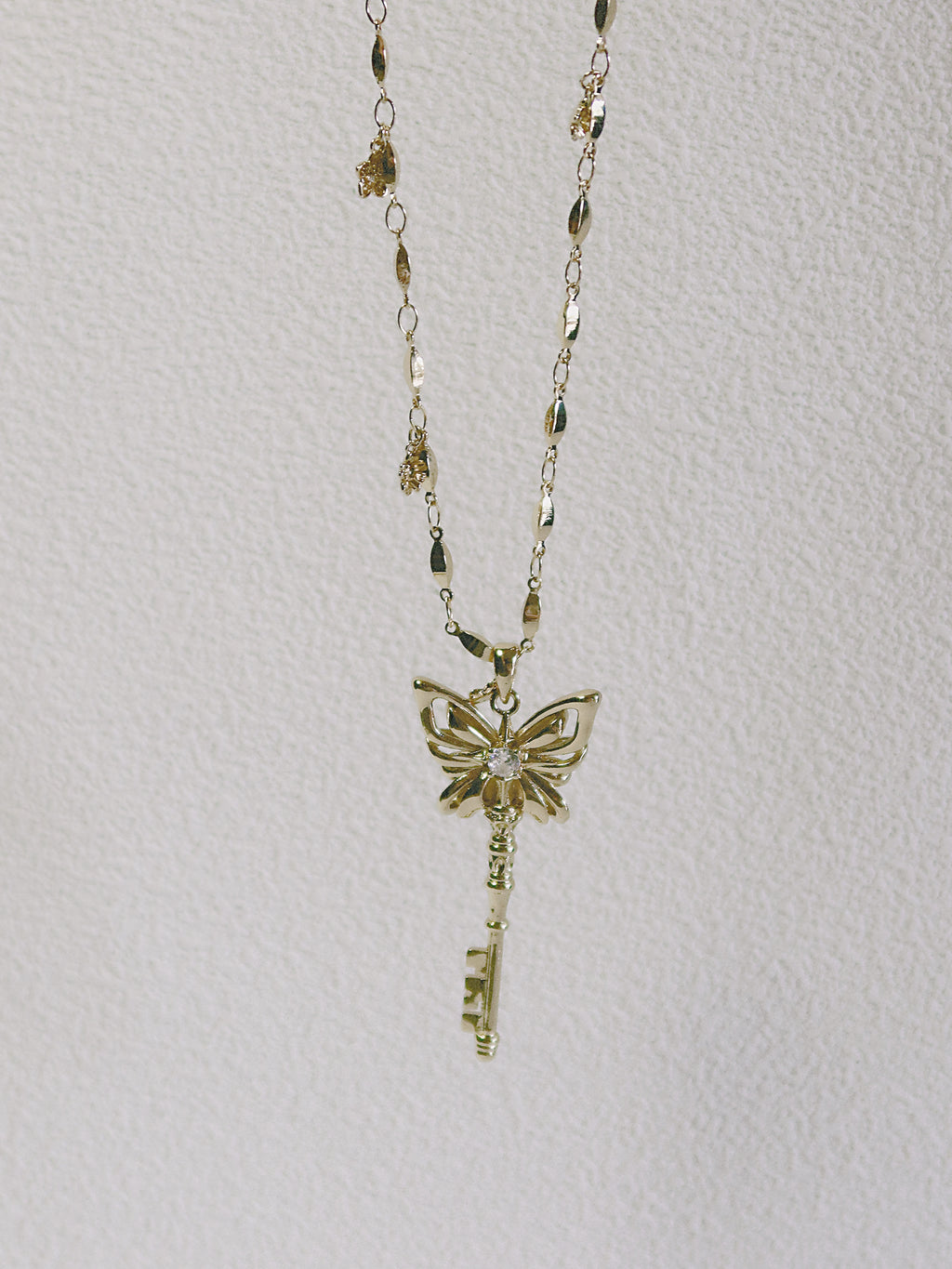 The Butterfly Key. Radiant Pendant Necklace