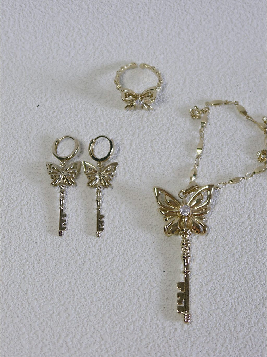 The Butterfly Key. Radiant Pendant Necklace