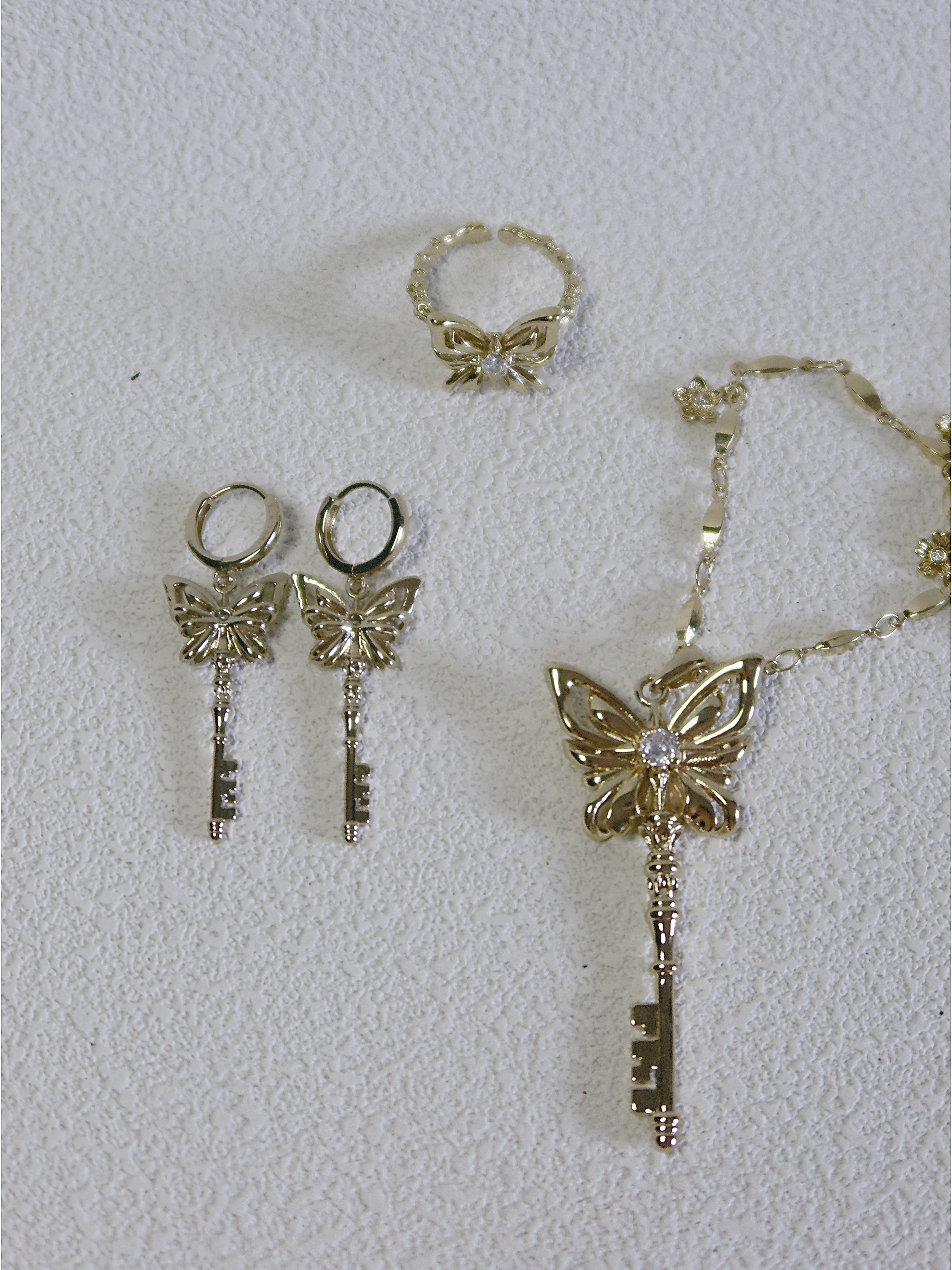 The Butterfly Key. Radiant Pendant Necklace